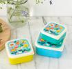 Three plastic snack boxes in yellow light blue turquoise and cream featuring prints of butterflies amongst flowers