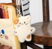 Cat-shaped plush keyring with a metal clasp