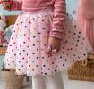 Pink skirt with colourful polka dots