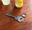 Guitar-shaped fridge magnet with built-in bottle openers in silver