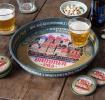 Round metal serving tray with vintage German beer design and colorful town illustration
