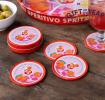 Four round coaster with Italian Aperitivo Spritz design in a storage tin