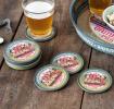 Four round coasters with vintage German beer design and storage tin