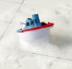 Wind-up bath toy shaped like a boat