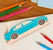 A blue ruler shaped like a car, with measurement markings along the bottom edge