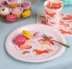 Pink unicorn-themed paper plate displayed with macarons and matching cup and napkin.
