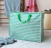 Large jumbo storage bag with green horizontal stripes and green handles.