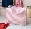 Large jumbo storage bag with pink horizontal stripes and pink handles.