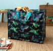 Large storage bag with a multi‑coloured dragons on a dark blue background and turquoise handles.
