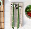 Green bamboo-themed chopsticks set with two panda ceramic rests