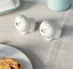 Dog‑shaped ceramic salt and pepper shakers .