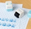 Puppy-themed roller stamp with a smiling face