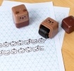 Brown bear-themed roller stamp with the cap removed,