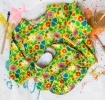 Bright floral bib and vest set with matching colourful pattern