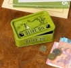 Mini storage tin with an olive oil illustration on the front.