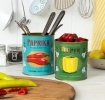 Two storage tins labelled Paprika and Pepper, with red and yellow pepper illustrations.