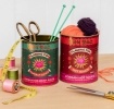 Two Flaming Fox Korean sauce storage tins, one red hot sauce and one green bibimbap design