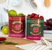 Two Flaming Fox Korean sauce storage tins, one red hot sauce and one green bibimbap design