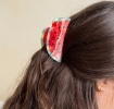 Hair claw clip featuring a fruity watermelon slice design, with hints of marbling and translucence. 