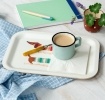 Wooden tray with sausage dog design, shown with a mug and napkin.