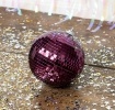 Plum hanging disco ball 10cm ornament with mirrored tiles.