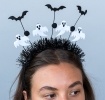 Halloween headband with black tinsel, ghost decorations and bats.