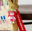 Copilot said:  Cherry girl bag charm with red cherry hat, pink outfit, silicone wrist strap and keyring