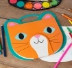Orange cat-faced sketchbook with teal handle, stylised eyes, whiskers and ears.