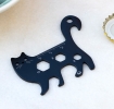 Black cat-shaped multi-tool with ruler and wrench cut-outs.