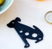 Dog-shaped multi-tool with ruler and wrench cut-outs.
