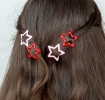 Red and pink star hair clips in a set of four.