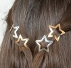 Gold and silver star hair clips in a set of four.