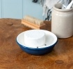 Round two-part soap dish with drainage holes in blue.