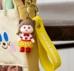 Strawberry girl bag charm with yellow polka dot skirt, silicone wrist strap and keyring