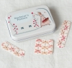 Gardener’s plasters in tin with butterfly-pattern plasters shown.