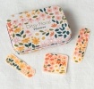 Floral plaster tin with matching flower-patterned plasters 