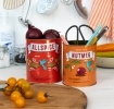 Set of two retro-style storage tins with allspice and nutmeg spice label designs