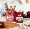 Set of two retro-style storage tins with poultry seasoning and goose pâté designs