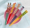 Set of five pairs of colourful chopsticks with cute animal and fruit designs
