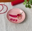 Pink trinket dish with red chilli and “HOT” text