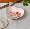 Heart-shaped pink trinket dish with floral design