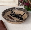 Conical jute bowl in natural and black.
