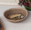 Conical jute bowl in natural, black and brown.