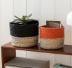 Set of two jute storage baskets in black and orange.