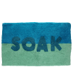 Blue and green bath mat with the word ‘SOAK’ in the center.