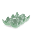 Green ceramic egg holder with six curved compartments for storing eggs