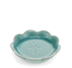 Ceramic trinket dish with a scalloped edge and a floral design in the centre.