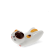 Ceramic cat‑shaped chopstick rest with brown and yellow patches.