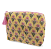 Yellow quilted wash bag with a pink and green flowers design.