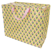 Yellow jumbo storage bag with a pink floral pattern and pink handles.